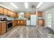 Spacious kitchen featuring wood cabinets, modern appliances, and wood backsplash at 1033 Sagamore Dr, Louisburg, NC 27549