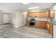 Well-maintained kitchen with stainless steel appliances, granite countertops, and wood cabinets at 1033 Sagamore Dr, Louisburg, NC 27549