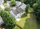 Aerial shot of backyard featuring a patio and mature trees at 107 Woolard Way, Apex, NC 27502