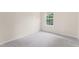 Bedroom featuring a carpeted floor, and a window providing natural light at 107 Woolard Way, Apex, NC 27502