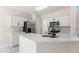 Bright kitchen with white cabinetry, new appliances, quartz countertop, and stainless-steel sink at 107 Woolard Way, Apex, NC 27502