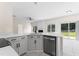 Modern kitchen featuring stainless steel appliances, white countertops, and ample natural light at 107 Woolard Way, Apex, NC 27502
