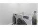 Laundry room featuring a side-by-side washing machine and dryer set with easy to use controls at 107 Woolard Way, Apex, NC 27502