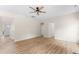 Inviting living room features wood floors and neutral walls, creating a bright and airy space at 107 Woolard Way, Apex, NC 27502