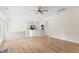Open-concept living area with wood floors connecting to the kitchen, perfect for entertaining at 107 Woolard Way, Apex, NC 27502