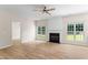 Spacious living room with a cozy fireplace and large windows that offer plenty of natural light at 107 Woolard Way, Apex, NC 27502
