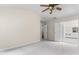 Spacious main bedroom with a ceiling fan and open doorway to the main bath at 107 Woolard Way, Apex, NC 27502