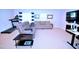 Finished basement featuring cozy seating, exercise equipment, and ample space for entertainment at 1141 Boxcar Way, Apex, NC 27502