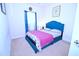 Comfortable bedroom with a blue bed frame, soft carpeting, and a window with stylish curtains at 1141 Boxcar Way, Apex, NC 27502