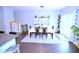 Inviting dining area with a modern table, stylish decor, and sliding glass doors for natural light at 1141 Boxcar Way, Apex, NC 27502