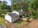 Two-story home featuring a wooden deck and grassy backyard with mature trees and light beige siding at 1143 Sturdivant Dr, Cary, NC 27511