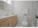 Tastefully designed bathroom with a vanity, gold hardware, and a bathtub-shower combination at 1143 Sturdivant Dr, Cary, NC 27511