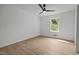 A serene bedroom featuring a ceiling fan, window, and ample closet space at 1143 Sturdivant Dr, Cary, NC 27511