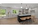 Stylish kitchen boasting a large island, stainless appliances, and pendant lighting at 1143 Sturdivant Dr, Cary, NC 27511