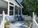 Outdoor deck area with seating, planters, and scenic view of the lush greenery at 11609 Us 401, Fuquay Varina, NC 27526