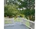 A back yard view from the deck with a beautiful lawn and lush trees at 11609 Us 401, Fuquay Varina, NC 27526