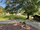 This large backyard features a fire pit, picnic table and mature trees at 11609 Us 401, Fuquay Varina, NC 27526