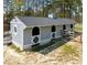 This horse barn has multiple stalls and an exterior wash area at 11609 Us 401, Fuquay Varina, NC 27526