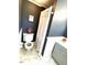 Cozy bathroom featuring a white toilet, shower with patterned curtains, and blue accent wall at 11609 Us 401, Fuquay Varina, NC 27526