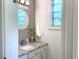 Modern bathroom with updated vanity, shiplap wall and stylish fixtures at 11609 Us 401, Fuquay Varina, NC 27526