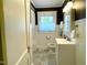 Well-lit bathroom featuring a vanity with a gray tile countertop and a shower/tub combination at 11609 Us 401, Fuquay Varina, NC 27526