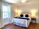 Inviting bedroom features hardwood floors, soft lighting, and a comfortable bed at 11609 Us 401, Fuquay Varina, NC 27526