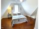 Cozy bedroom with sloped ceilings and hardwood floors at 11609 Us 401, Fuquay Varina, NC 27526
