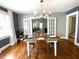 Traditional dining room featuring hardwood floors and a stylish chandelier over a formal dining set at 11609 Us 401, Fuquay Varina, NC 27526