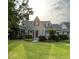Attractive home with gray siding, a manicured lawn, and an inviting front entrance at 11609 Us 401, Fuquay Varina, NC 27526