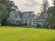 Charming home featuring a large lawn, a classic roof, and mature trees at 11609 Us 401, Fuquay Varina, NC 27526