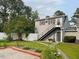Backyard view with exterior stairs accessing an apartment above the garage at 11609 Us 401, Fuquay Varina, NC 27526