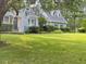 Lovely home with a large front yard and charming architectural details at 11609 Us 401, Fuquay Varina, NC 27526