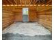 View of a clean horse stall with wood frame and a partially open gate facing a paddock area at 11609 Us 401, Fuquay Varina, NC 27526