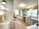 Bright kitchen with stainless steel appliances, wood floors and white cabinets at 11609 Us 401, Fuquay Varina, NC 27526