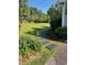 Lush garden pathway alongside this home, complete with stepping stones and vibrant greenery at 11609 Us 401, Fuquay Varina, NC 27526