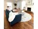 Cozy living room features a fireplace, hardwood floors, and comfortable seating at 11609 Us 401, Fuquay Varina, NC 27526