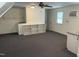 Versatile living space with a built-in bookshelf, neutral walls, and ceiling fan at 11609 Us 401, Fuquay Varina, NC 27526