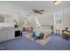 This main bedroom features a colorful area rug, a comfortable sitting area, and lots of natural light at 11609 Us 401, Fuquay Varina, NC 27526