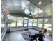 Bright sunroom with many windows overlooking the spacious backyard and patio area at 11609 Us 401, Fuquay Varina, NC 27526