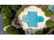 Aerial view of a large community pool surrounded by lounge chairs, tennis courts and lush landscaping at 118 Killingsworth Dr, Cary, NC 27518