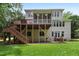Expansive backyard features a deck, screened porch, patio, and access to a beautifully maintained lawn at 118 Killingsworth Dr, Cary, NC 27518