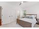 Comfortable bedroom featuring a ceiling fan, neutral tones, and direct access to the en-suite bath at 118 Killingsworth Dr, Cary, NC 27518