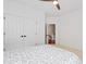 Neutral bedroom featuring a view to the upstairs hallway and a large double-door closet at 118 Killingsworth Dr, Cary, NC 27518