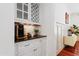 Elegant coffee bar with a built-in beverage center and granite countertop at 118 Killingsworth Dr, Cary, NC 27518