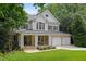 Beautiful two-story home featuring a covered front porch and stone accents on the garage at 118 Killingsworth Dr, Cary, NC 27518