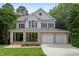 Charming two-story home with a welcoming front porch and a well-manicured lawn at 118 Killingsworth Dr, Cary, NC 27518