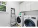 Well-lit laundry room with modern washer and dryer at 118 Killingsworth Dr, Cary, NC 27518