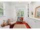 Cozy home office with built-in shelving, natural light, and a comfortable seating area at 118 Killingsworth Dr, Cary, NC 27518