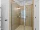 Bright, tiled shower enclosure with glass doors, providing a luxurious bathing experience at 118 Killingsworth Dr, Cary, NC 27518