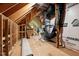 Unfinished attic space with exposed wooden beams, ready for customization at 120 Firefly Ln, Louisburg, NC 27549